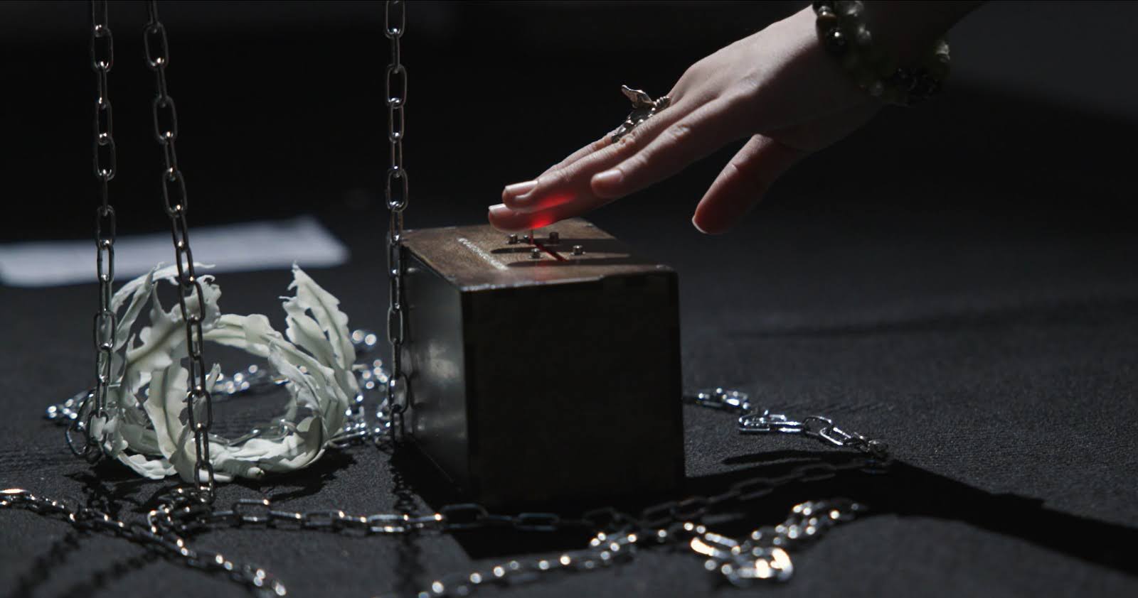 hand moving a slider from Yimiao Pan's exhibit