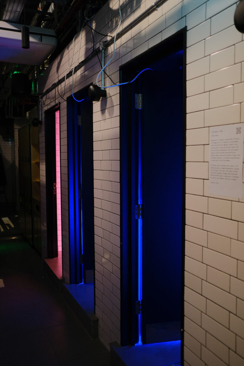 bathroom installation with blue and pink neon lights